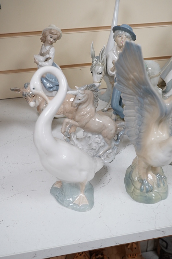 A quantity of Lladro style and Nao figures (12). Condition - good